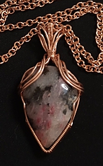 teardrop rhodonite pendant with copper epaulette wrap